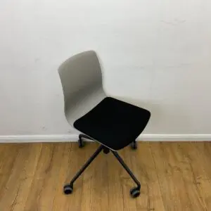 black and grey meeting chair on 4 star base with castors