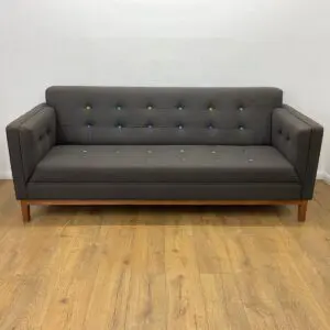 frovi grey reception sofa with multicoloured button detail and oak leg