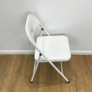 white metal folding chair